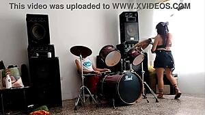 She strips and dances showing her ass while they drum! 🔥