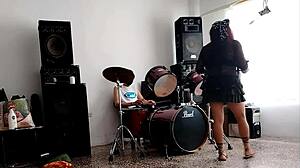 She strips and dances showing her ass while they drum! 🔥