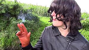 i enjoy smoking in my cinnamon leather trousers outdoors