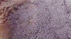 Bare feet sinking into warm beach sand