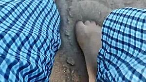 Bare feet sinking into warm beach sand