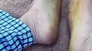 Bare feet sinking into warm beach sand