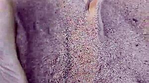 Bare feet sinking into warm beach sand