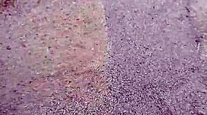 Bare feet sinking into warm beach sand