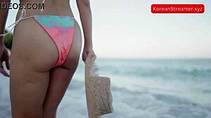 just saw this sexy asian model strolling on the beach in a tiny bikini.