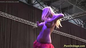 Cock sharing unfolds in wild public stage performance