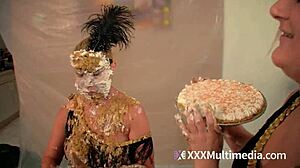 Two blondes get wet and messy, pieing each other in the face