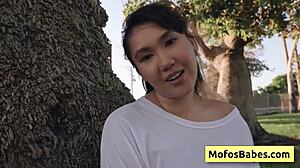 asian teen shares big boobs with friend outdoors