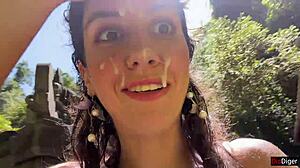 A teen gets a facial in a public locker room. She walks cum-covered to the waterfall.