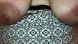 my big booty wife dances and shakes her ass, showing off her big tits and milf body.