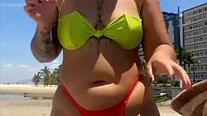 African Wife Flashes Stuffed Bikini On Beach