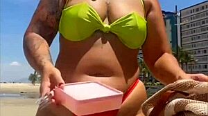 African Wife Flashes Stuffed Bikini On Beach