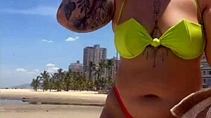 African Wife Flashes Stuffed Bikini On Beach
