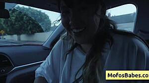 Sexy asian hottie plays with natural big boobs in car