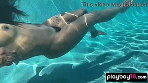 Naked ebony milf Ana Foxxx fingers her hairy black pussy outdoors under water