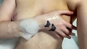 What does this horny British slut do in the shower alone?