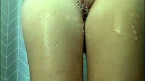 Teen shaves her pussy in the shower close up