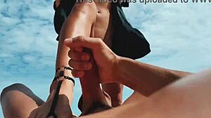 Blonde Girl Strokes Guy with Feet at Nudist Beach! 🦶💦