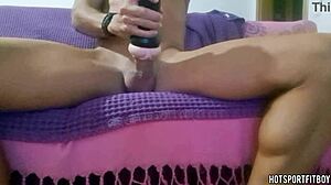 Hot guy humps fleshlight on couch, moaning loud, cums inside.