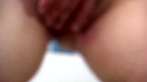 Titty Slut Fingers Her Pussy with a Dildo While Watching Porn