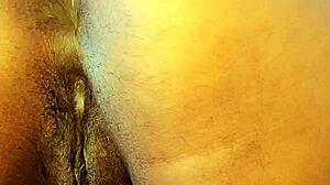 amateur girl with big tits squirts during anal masturbation