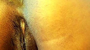 amateur girl with big tits squirts during anal masturbation