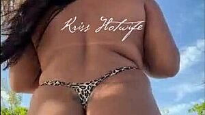 hey, check this married slut showing off her big ass in a tiny bikini at the beach?