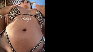 hey, check this married slut showing off her big ass in a tiny bikini at the beach?