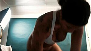 Exotic hottie spreads her shaved pussy wide for the nasty photographer during the shoot