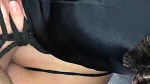 Bound and masked, she feels intense pleasure sucking cock in bondage.