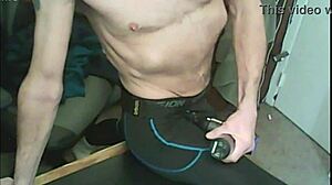 I stretch my skinny body using a massage gun while wearing compression leggings and a brace.