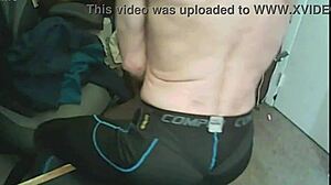 I stretch my skinny body using a massage gun while wearing compression leggings and a brace.