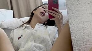 Is Ellie Leen Fingering Her Wet Shaved Pussy In Front Of The Mirror For Squirting?