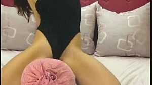 brunette dances in unitard on webcam