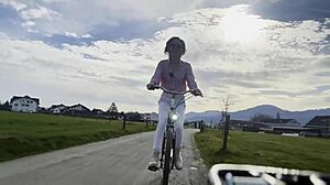 Beautiful blonde biker vlogs outdoor adventures on wheels