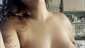 Curvy amateur goes naked for coffee, chatting with big breasts on display.