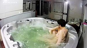 young lesbian couple enjoys a steamy bath with intimate fingering