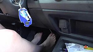 Brunette Drives Barefoot In Outdoor Car