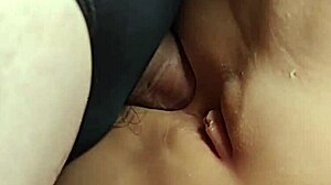 is fucking her cute shaved ass with double penetration