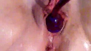 slow motion up close of wife plunging toy into her dripping squirting pussy