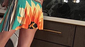 Hot Brunette Babe In The Kitchen Removes Her Panties Under Mini Skirt