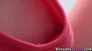 An Asian teen 18+ is filmed outdoors in high definition