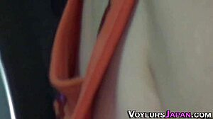 An Asian teen 18+ is filmed outdoors in high definition