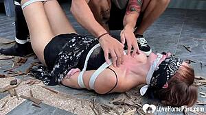 Redhead cutie slut bound tight by hard rope