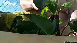 Why go naked watering plants on the balcony when anyone could spot your big natural tits?