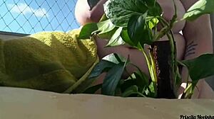 Why go naked watering plants on the balcony when anyone could spot your big natural tits?