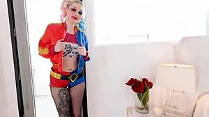 Arielle Aquinas, dressed as Harley Quinn, gives a blowjob to a huge cock and swallows the cum.