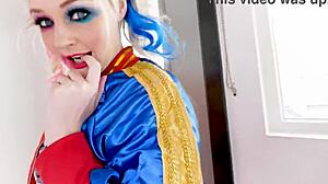 Arielle Aquinas, dressed as Harley Quinn, gives a blowjob to a huge cock and swallows the cum.