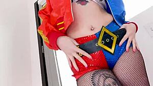 Arielle Aquinas, dressed as Harley Quinn, gives a blowjob to a huge cock and swallows the cum.
