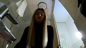 Hot blonde with big tits and ass strips in pantyhose and miniskirt in bathroom